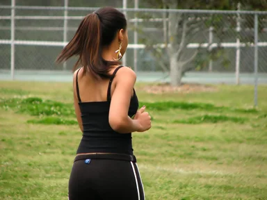 Free Stock Photo: A beautiful teen African American girl running by a tennis court