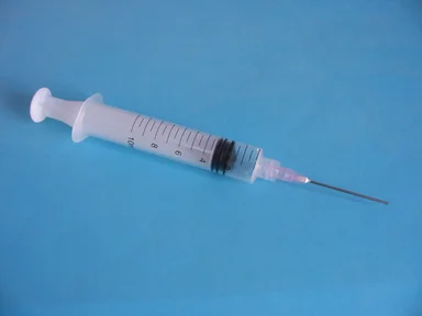 Free Stock Photo: Isolated syringe fitted with a needle