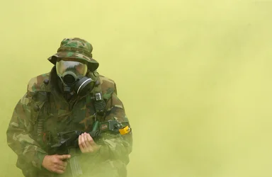 Free Stock Photo: Soldier in gas mask with cloud of smoke