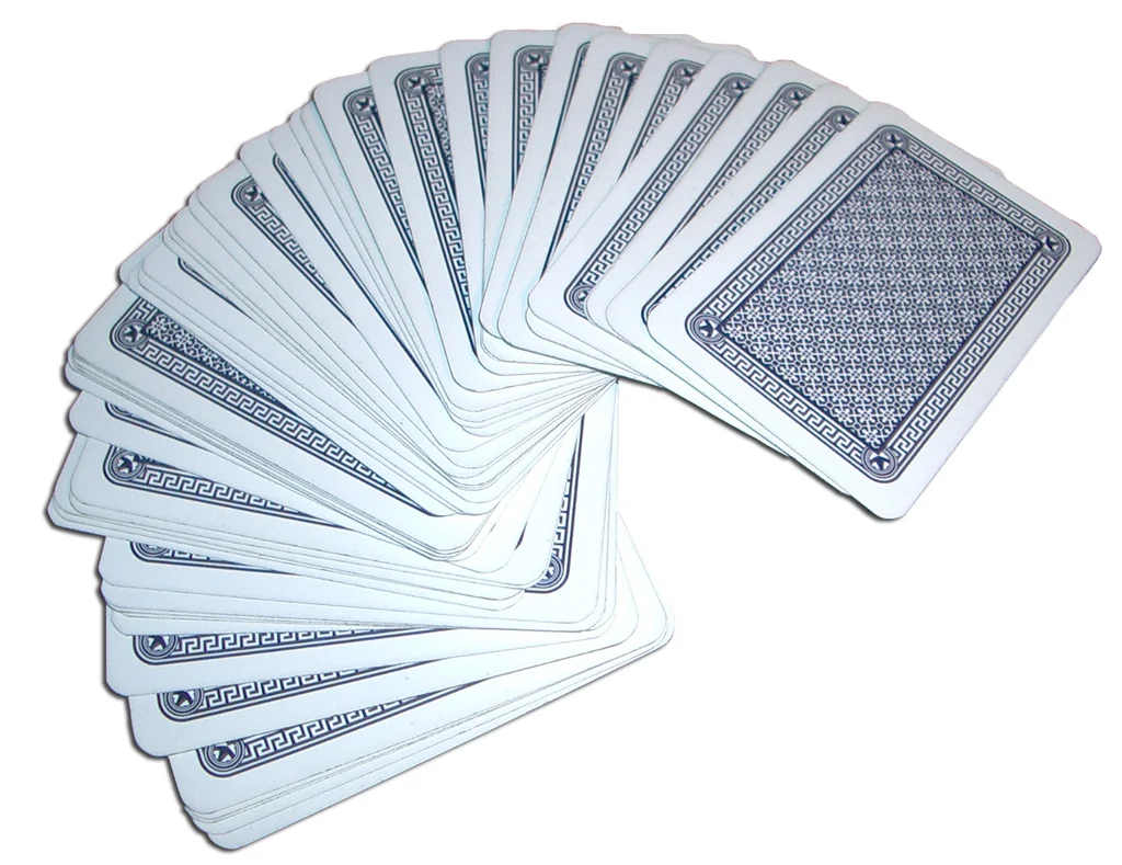 A deck of cards spread out on a white background : Free Stock Photo