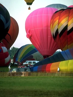 Free Stock Photo: Hot air balloons taking off from a field