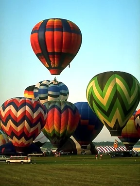 Free Stock Photo: Hot air balloons taking off from a field