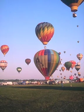 Free Stock Photo: Hot air balloons taking off from a field