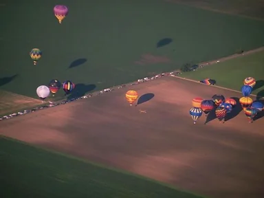 Free Stock Photo: Hot air balloons flying over a field