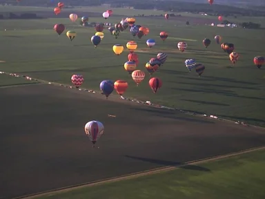 Free Stock Photo: Hot air balloons flying over a field