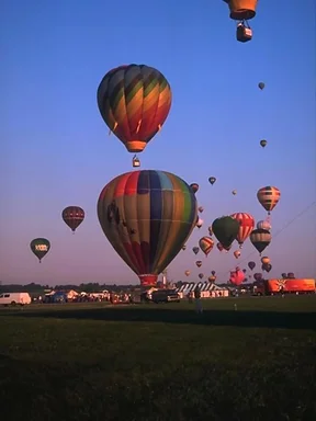 Free Stock Photo: Hot air balloons taking off from a field