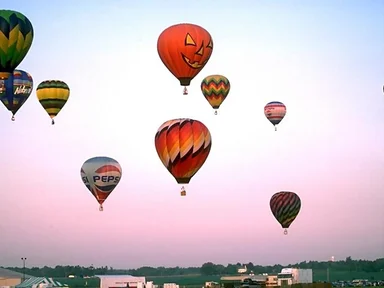 Free Stock Photo: Hot air balloons taking off from a field