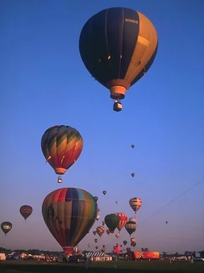 Free Stock Photo: Hot air balloons taking off from a field