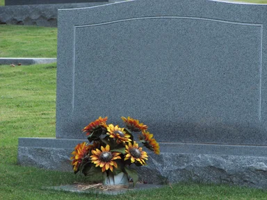 Free Stock Photo: A blank tombstone with flowers