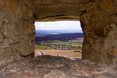 Free Stock Photo: A mountain view through a stone window
