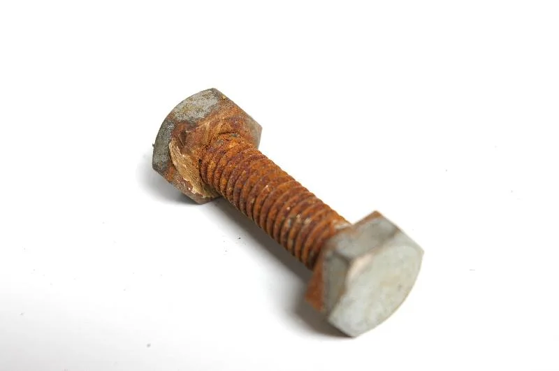 A bolt and nut isolated on a white background : Free Stock Photo