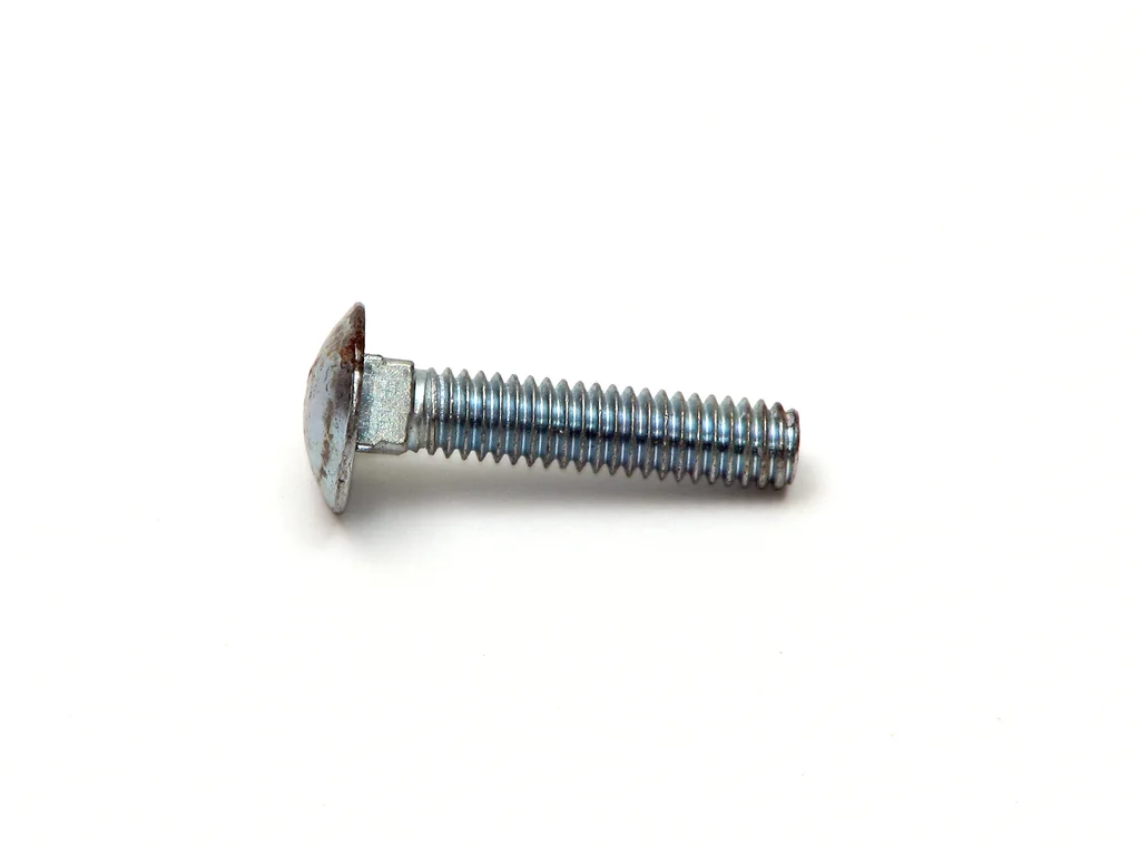 A short screw isolated on a white background : Free Stock Photo