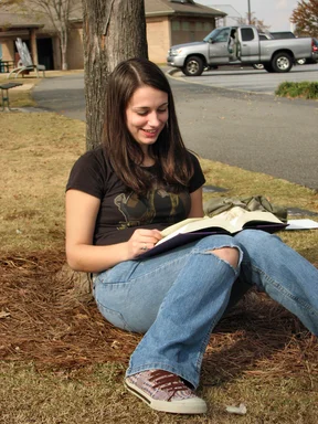 Free Stock Photo: Teenage girl reading a book