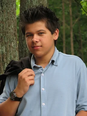 Free Stock Photo: A young latino teen boy posing outdoors by a tree