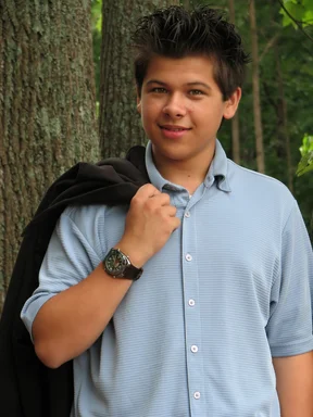 Free Stock Photo: A young latino teen boy posing outdoors by a tree
