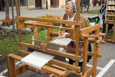 Free Stock Photo: An older woman weaving in the street