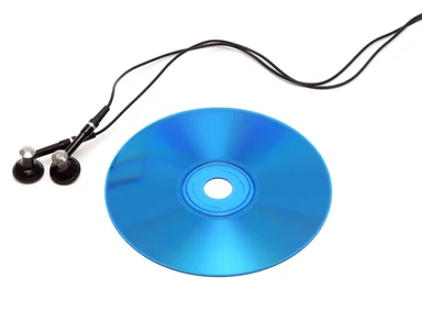 Free Stock Photo: A blue cd with headphones isolated on a white background.