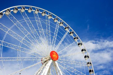 Free Stock Photo: A large ferris wheel with a blue sky background