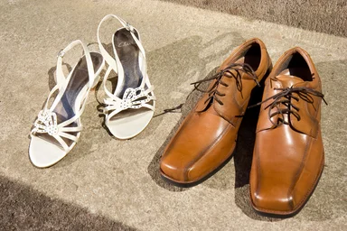 Free Stock Photo: Two pairs of shoes on the ground