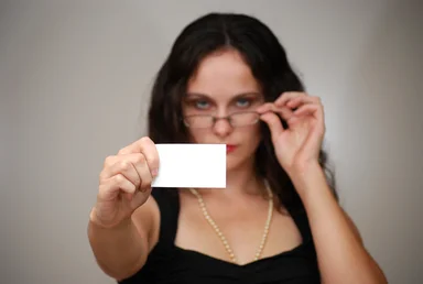 Free Stock Photo: A beautiful business woman holding a blank business card