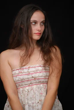Free Stock Photo: A beautiful young woman posing before a black background