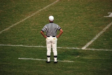 Free Stock Photo: A football referee standing on an empty football field