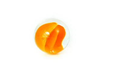 Free Stock Photo: An orange marble isolated on a white background