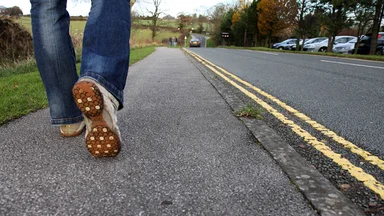 Free Stock Photo: Close-up of feet walking on a road