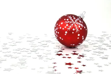 Free Stock Photo: A red Christmas ornament with silver stars on the floor