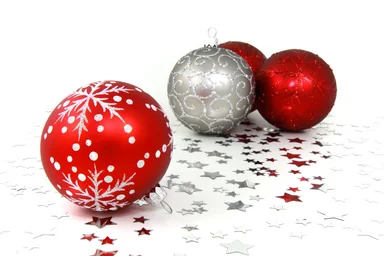 Free Stock Photo: Red and silver Christmas ornaments with silver stars on a white floor
