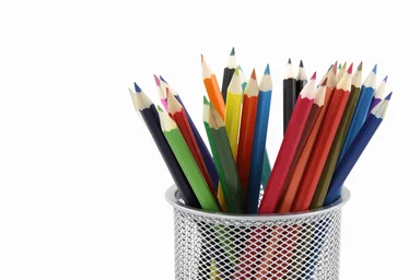 Free Stock Photo: Colored pencils in a pencil holder isolated on a white background