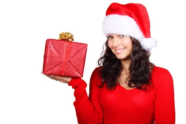 Free Stock Photo: A beautiful young woman with a Christmas present