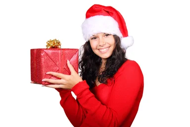 Free Stock Photo: A beautiful young woman with a Christmas present