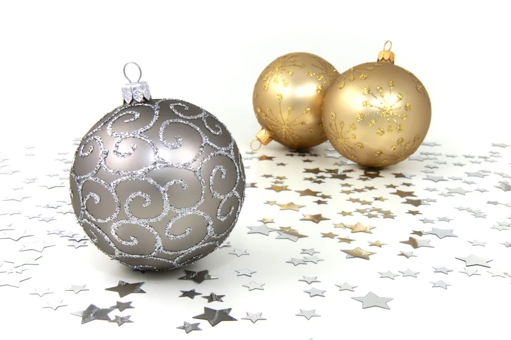 Silver and gold Christmas ornaments with silver stars on a white floor : Free Stock Photo