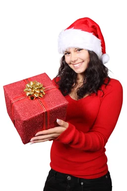 Free Stock Photo: A beautiful young woman with a Christmas present