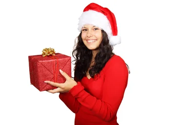 Free Stock Photo: A beautiful young woman with a Christmas present