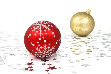 Free Stock Photo: Red and gold Christmas ornaments on a white floor with silver stars