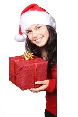 Free Stock Photo: A beautiful young woman with a Christmas present