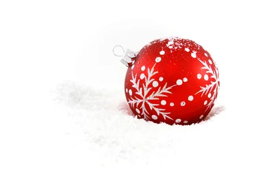 Free Stock Photo: A red Christmas ornament in the snow