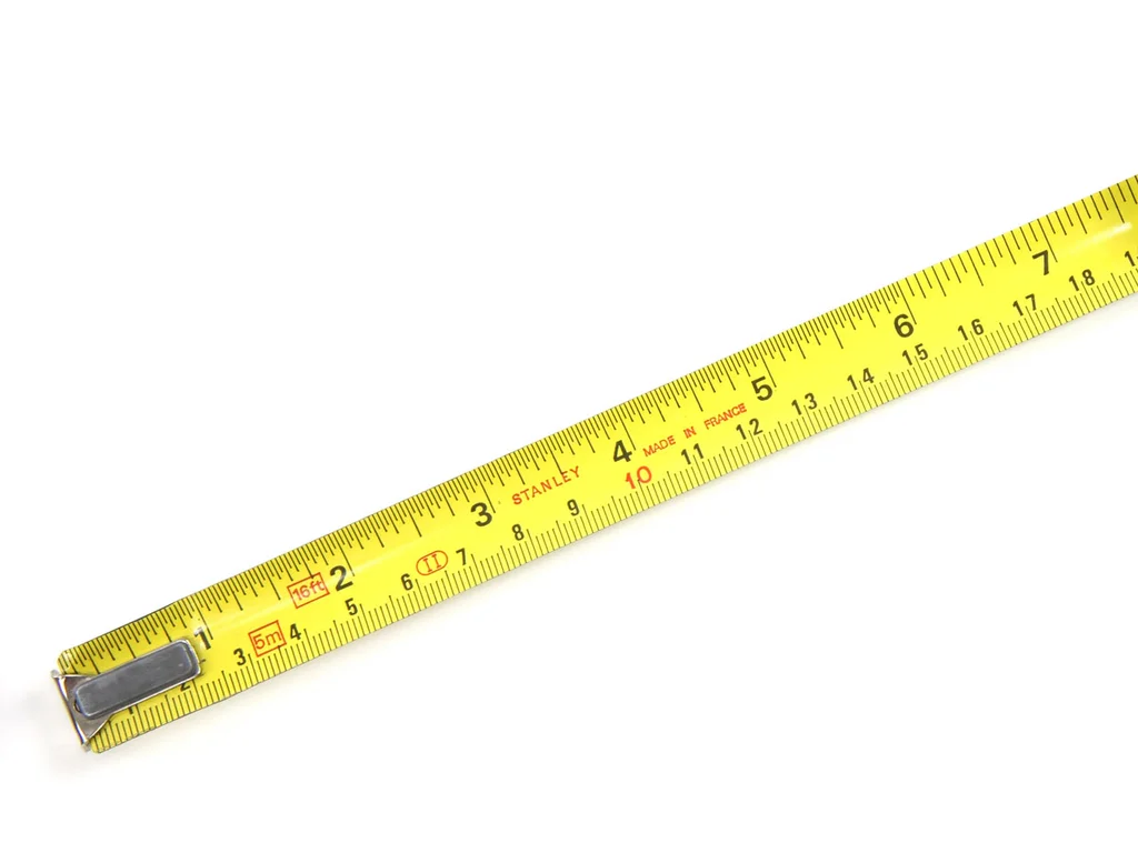A measuring tape isolated on a white background : Free Stock Photo