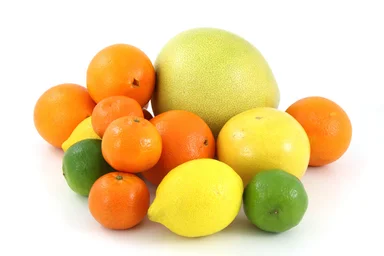 Free Stock Photo: A pile of citrus fruit isolated on a white background