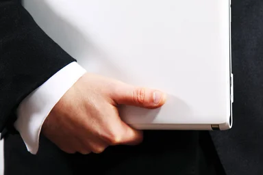 Free Stock Photo: Businessman holding a white laptop