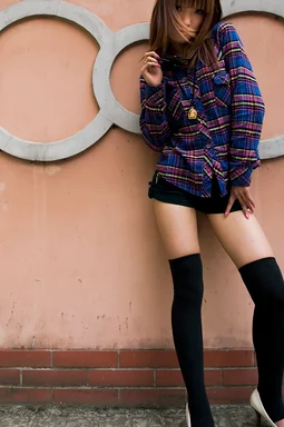 Free Stock Photo: A beautiful Chinese girl posing against a wall