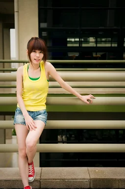 Free Stock Photo: A beautiful Chinese girl posing by against a railing