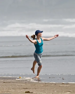 Free Stock Photo: A beautiful girl jumping on a beach