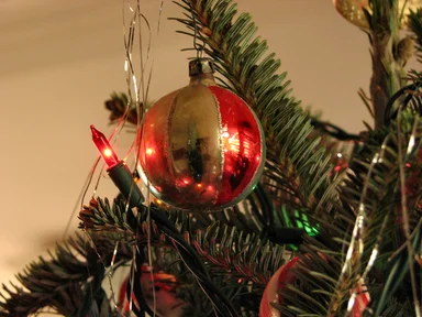 Free Stock Photo: Closeup of a red and gold glass ornament on a Christmas tree