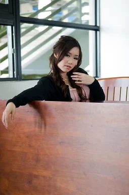 Free Stock Photo: A beautiful Chinese girl posing behind a bench