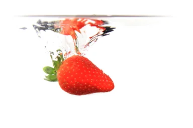 Free Stock Photo: A strawberry splashing in water