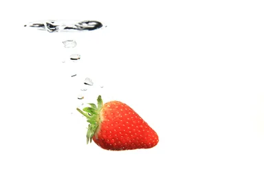 Free Stock Photo: A strawberry splashing in water