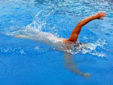 Free Stock Photo: A man swimming in a pool
